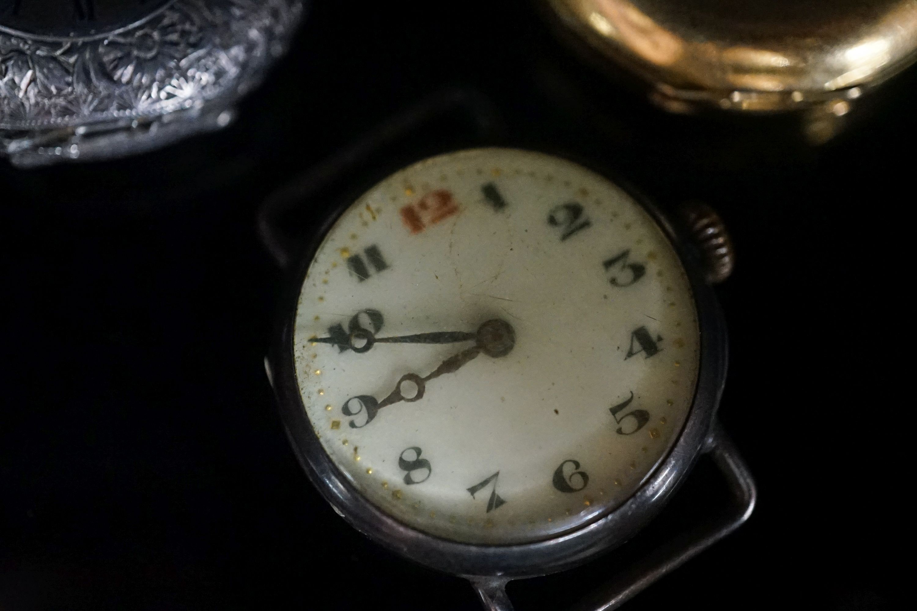 A gentleman's early 20th century continental 18k half hunter wrist watch, case diameter 33mm, gross weight 32.7 grams, together with two other silver watches.